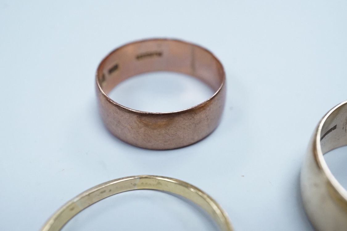 A 1970's 9ct gold wedding band, size W, a George V 9ct rose gold wedding band, 9.3 grams, a 1970's 18ct gold sapphire and diamond cluster ring, gross weight 4 grams, a modern silver mounted photograph frame, a modern sil